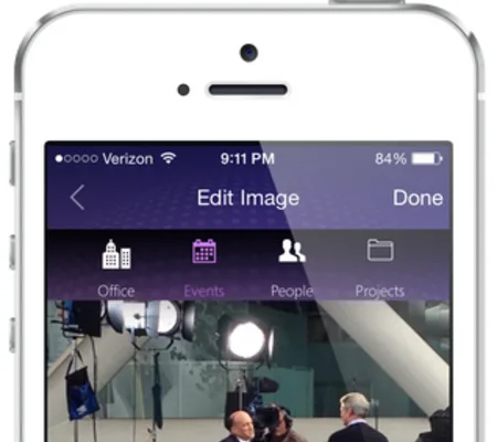 IPhone showing an 'Edit Image' screen with a photo of men at a press event.