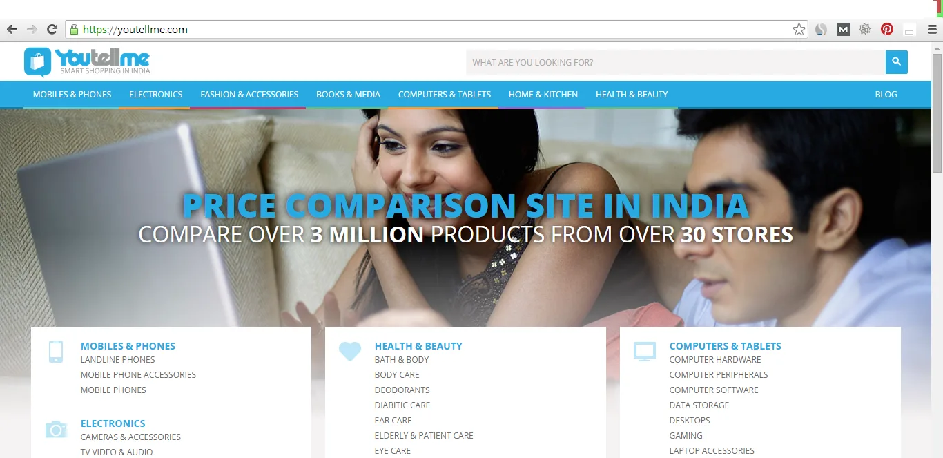 Homepage 'Price comparison site in India' with a man and woman at a laptop.