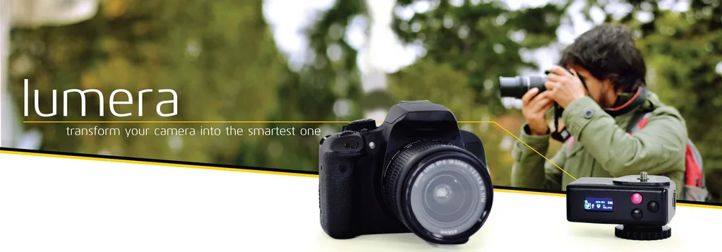 Banner reading "lumera, transform your camera into the smartest one" with a camera, an attachment device and a photographer.