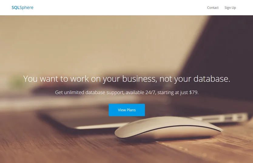 Landing page 'You want to work on your business, not your database.' with a mouse on a desk.