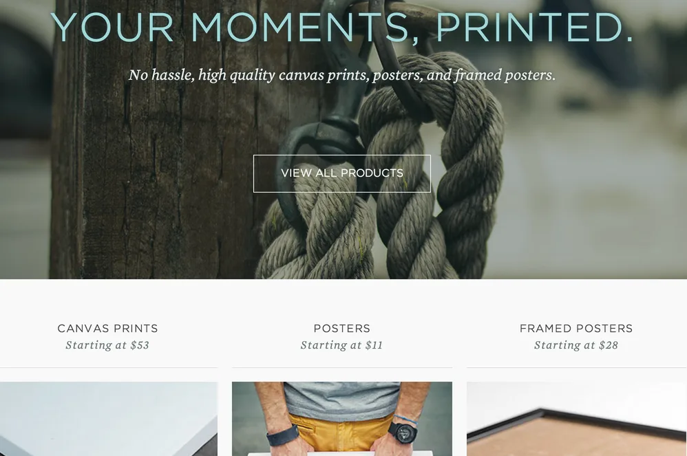 Landing page headlined "YOUR MOMENTS, PRINTED." with canvas print, poster and framed poster options.
