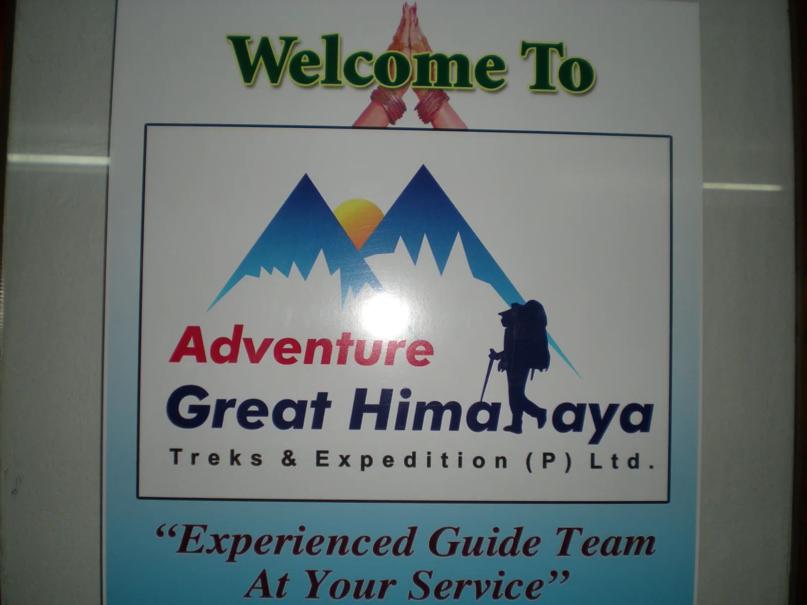Photo of a sign reading 'Welcome To Adventure Great Himalaya Treks & Expedition'.