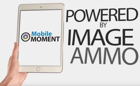 Hand holding a tablet showing the Mobile Moment logo beside the text "POWERED BY IMAGE AMMO".